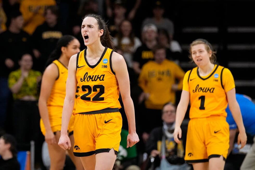 Iowa guard Caitlin Clark (22) celebrates in the first half of a first-round college basketball...