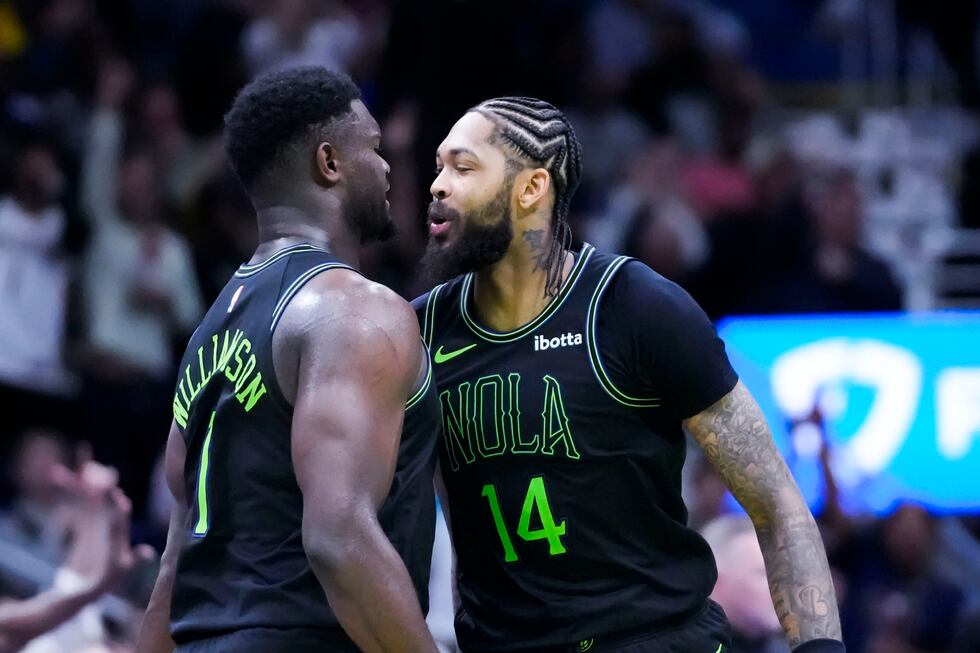 New Orleans Pelicans forward Brandon Ingram (14) and forward Zion Williamson (1) celebrate...