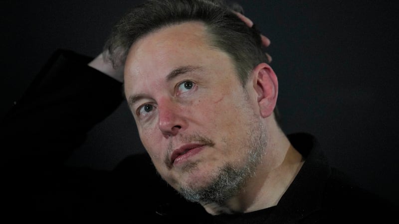 FILE - Elon Musk reacts during an in-conversation event with Britain's Prime Minister Rishi...