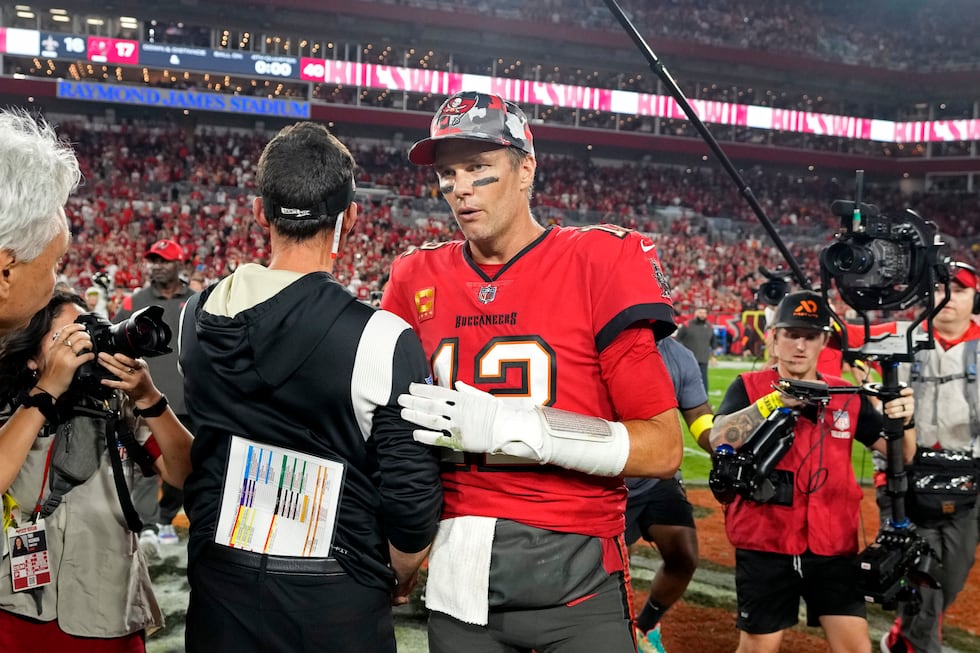 Tampa Bay Buccaneers quarterback Tom Brady (12) greets New Orleans Saints head coach Dennis...