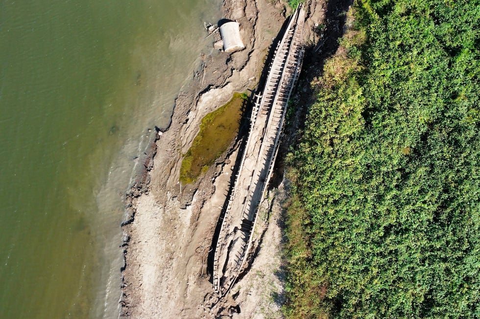 FILE - A shipwreck is exposed along the banks of the Mississippi River in Baton Rouge, due to...