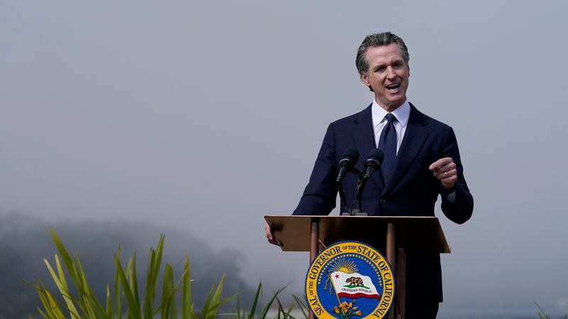 California Gov. Gavin Newsom speaks at the Presidio Tunnel Tops before the signing of a new...