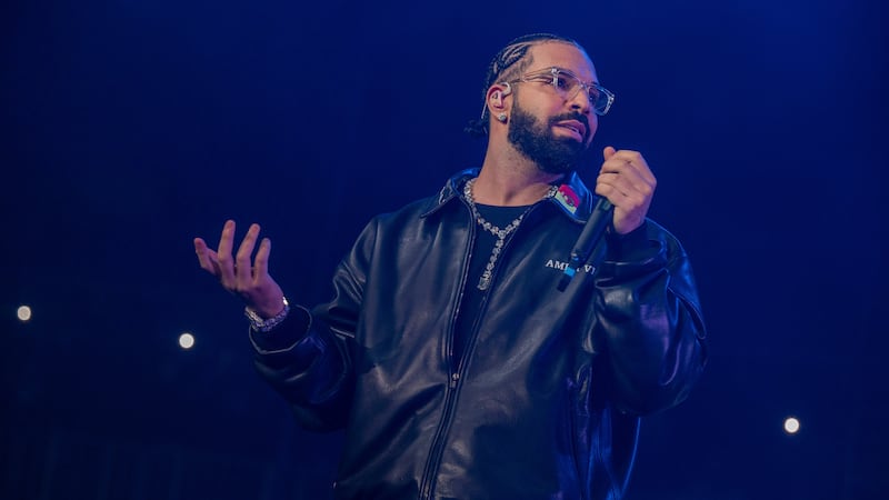 Drake, shown performing in this December 2022 file photo, has postponed his upcoming New...