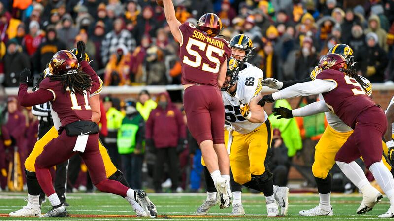 Minnesota linebacker Mariano Sori-Marin (55) slaps down a pass by Iowa quarterback Spencer...