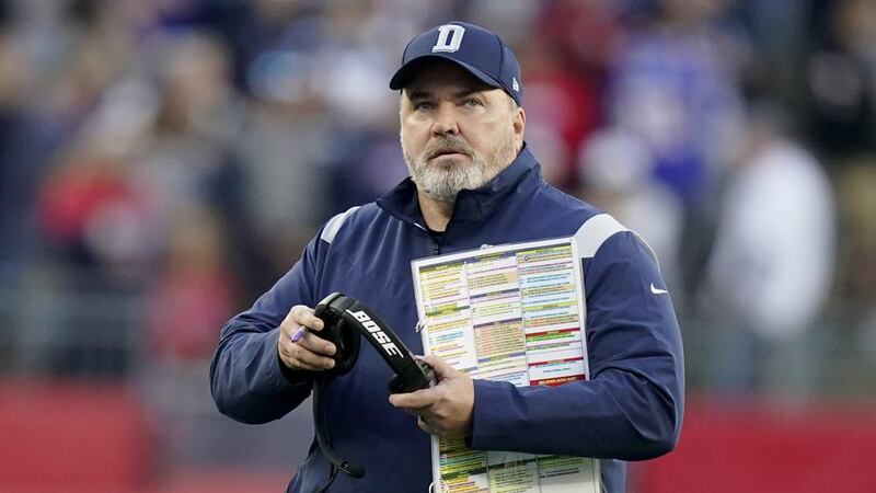 Dallas Cowboys head coach Mike McCarthy looks at the scoreboard during the first half of an...