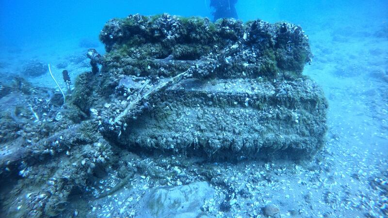 This Aug. 17, 2021 photo shows Quagga mussels cover the engine of a Bell P-39 Airacobra...