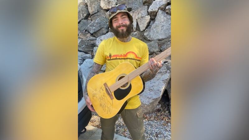 Post Malone has donated a signed guitar to help raise money for a nonprofit helping veterans.