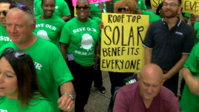 People upset about proposed changes that would impact people with solar systems protested in...