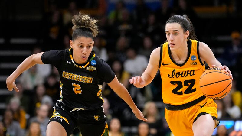 Iowa guard Caitlin Clark (22) drives up court past Southeastern Louisiana guard Cierria...