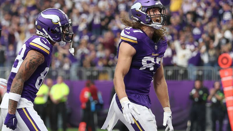 Minnesota Vikings tight end T.J. Hockenson, right, celebrates after scoring against the New...