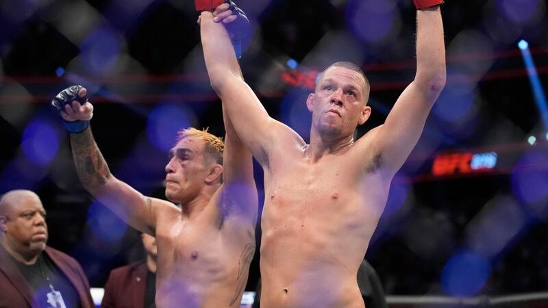 Former UFC fighter Nate Diaz, shown at right in this September 2022 file photo, was arrested...