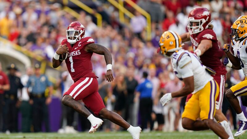 Arkansas quarterback KJ Jefferson (1) carries for a big gain in the first half of an NCAA...