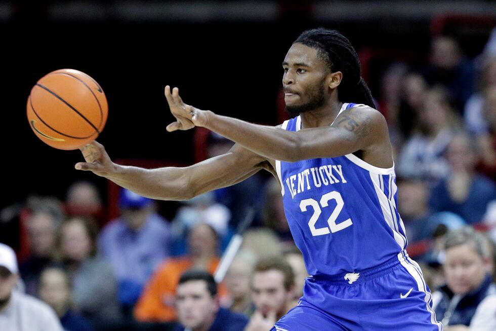 FILE - Kentucky guard Cason Wallace passes the ball during the first half of an NCAA college...