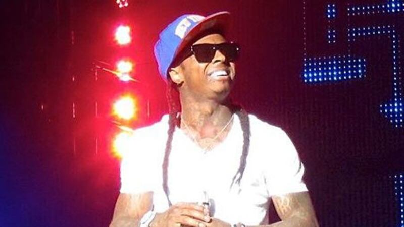 A photo of Lil Wayne in 2011 at a concert in Long Island, NY. (Source: Michael...
